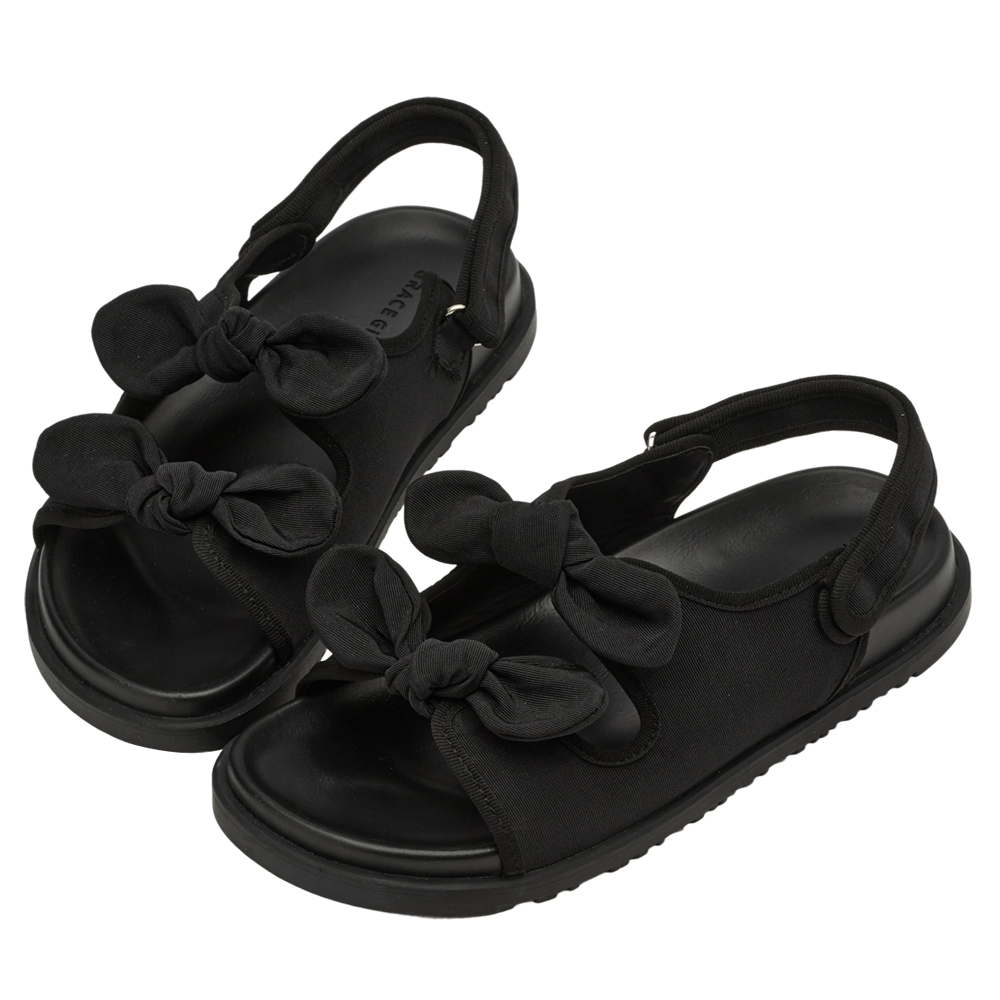 GraceGift平價女鞋 時尚秀場 圓頭 休閒甜感雙蝴蝶結可調節平底涼鞋 黑色